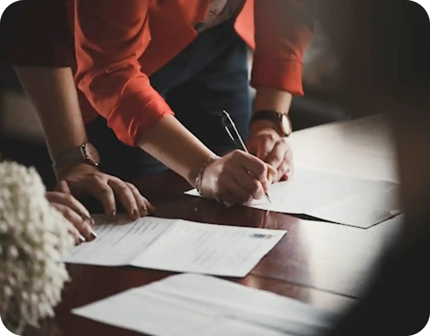 Hands reviewing legal paperwork